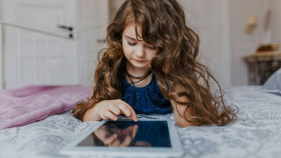 A young girl playing her favourite online game using uncapped wireless internet