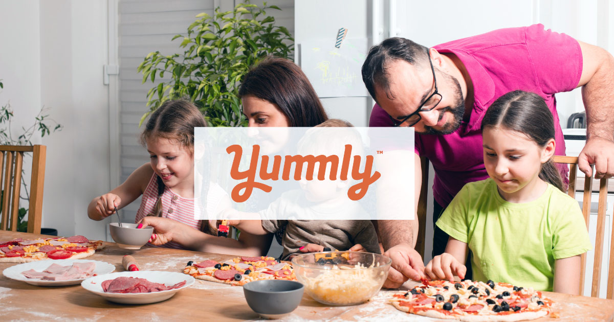 Parents making homemade pizza with kids using Yummly App | #BestInternetProvider